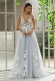 Soft tulle and applique lace wedding gown with short train and tie back bodice detail | fgm-maria