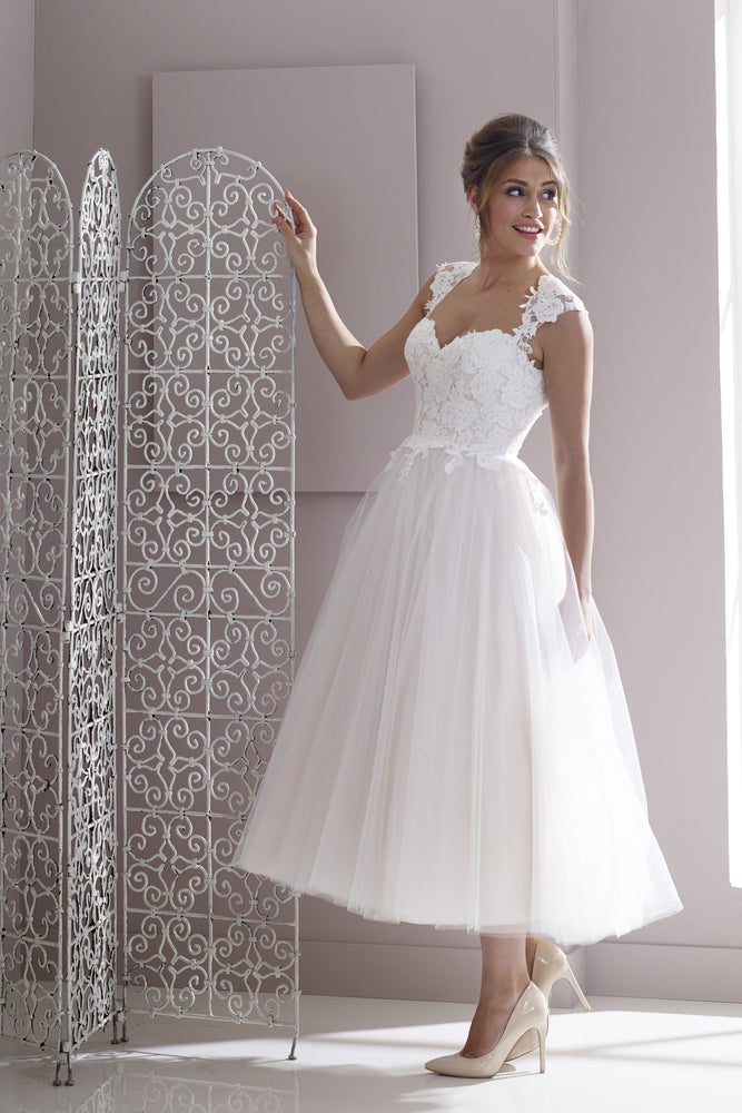 Lace and tulle tea length bridal gown with cut out back detail
