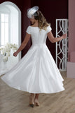 Back of short tea length wedding dress in luxury mikado
