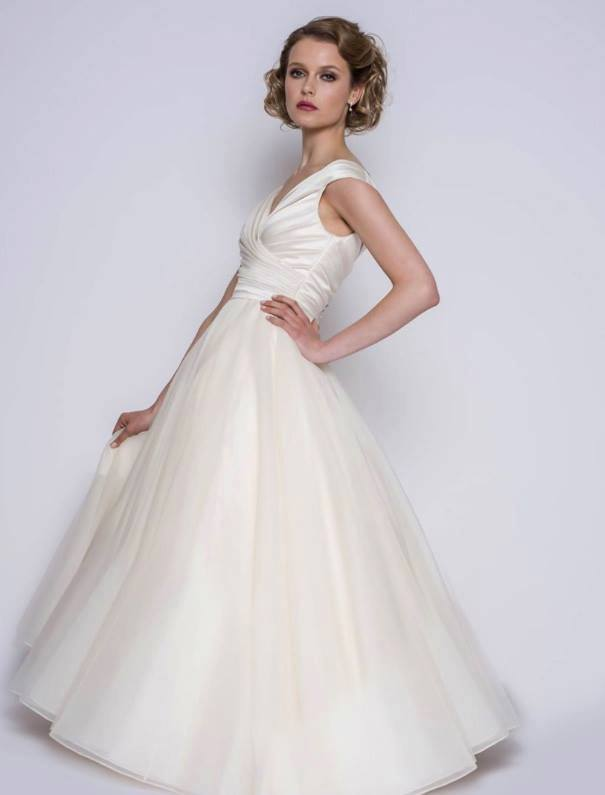 Full length satin and organza vintage style wedding dress in ivory
