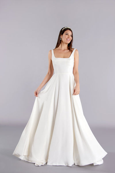 Full length pure simplicity crepe wedding gown with train and skirt pockets