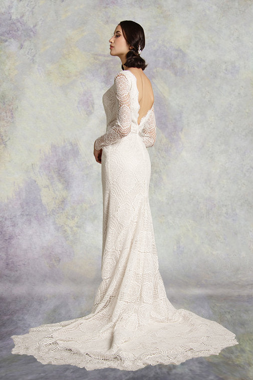 Side of lace fishtail wedding dress with long sleeves with a  soft satin belt on waistline and deep plunging neckline mirrored with a matching deep V- back