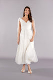 Soft tulle tea length wedding dress featuring V-neck and soft Boho full skirt.