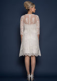 Back of  Knee length classic 60's style silk duchess satin wedding dress