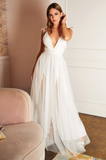 Ava is a  tulle gown with leg splits and open back.  Shown here in white.