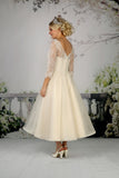 Back of the Cora tea length wedding dress in champagne