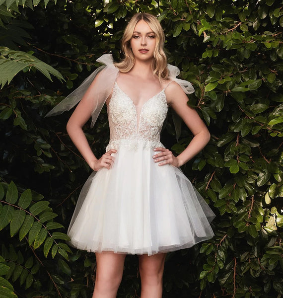 The Emily is a short layered off white tulle dress with beaded bodice and tulle tie straps