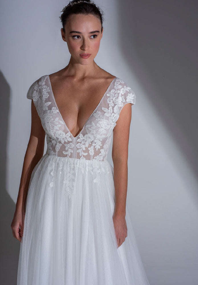 Bodice of the the Roseville delicate sheer wedding dress with fitted lace bodice and sparkle tulle layered skirt.