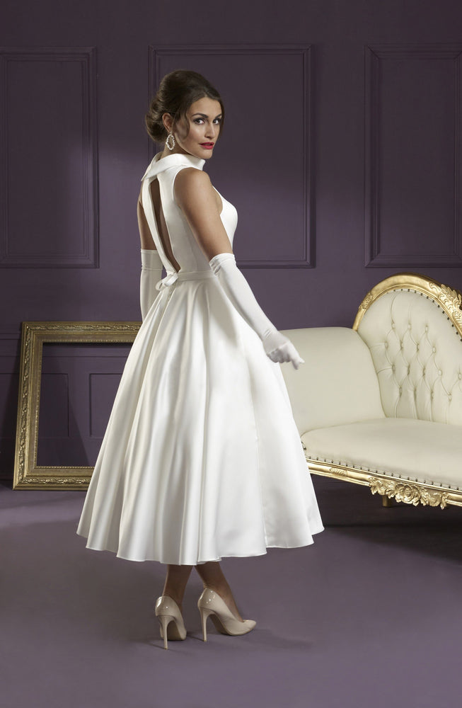 Back of Ivory satin tea length wedding gown with cut out back