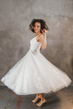 Tulle with lace appliqué tea length wedding gown. Swinging it!