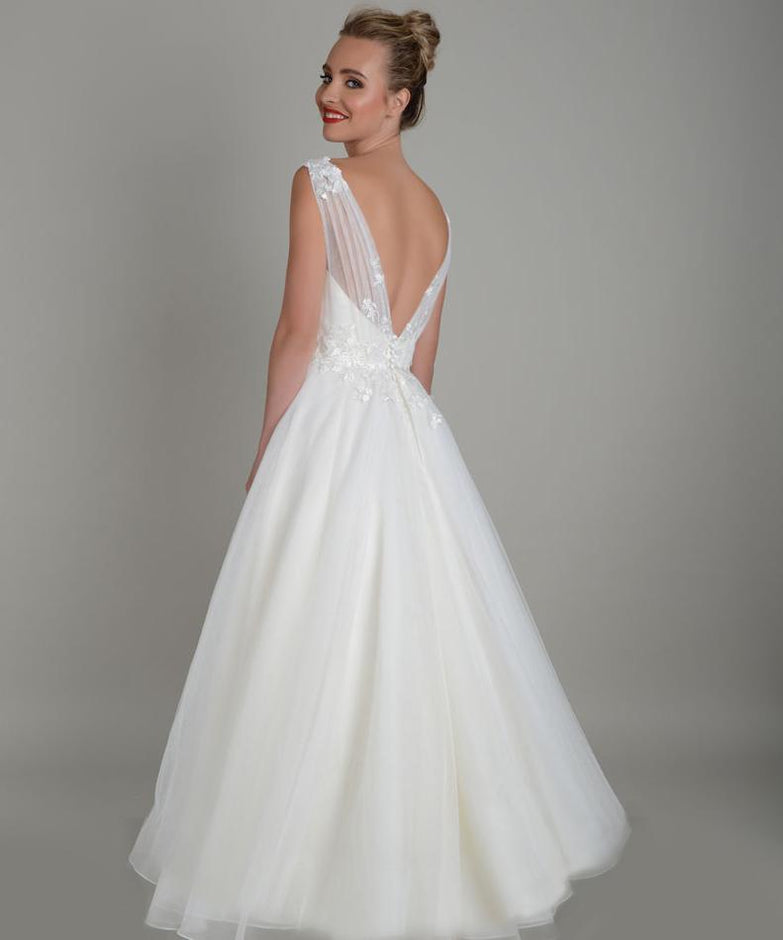 Back image of tea length wedding gown in super soft tulle with delicate lace appliqué