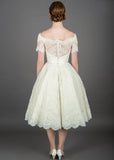 Back of Fifties style tea length wedding dress with glamorous off the shoulder neckline