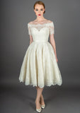 Fifties style tea length wedding dress with glamorous off the shoulder neckline