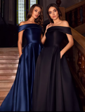 Full length heavy satin gown with dramatic though discreet side split and pockets shown in Blue and Black