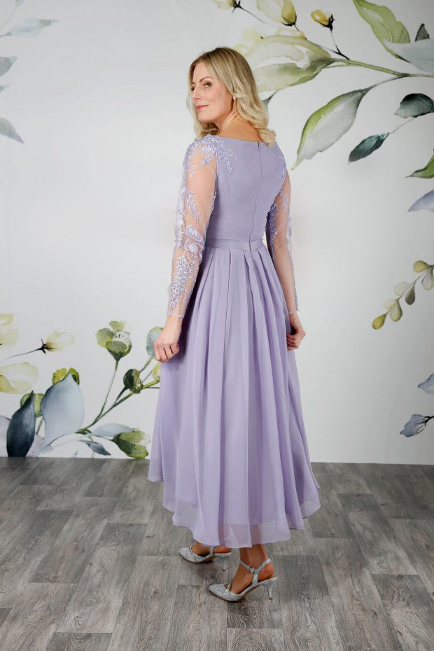 Back of tea length wedding dress in wisteria with high low hem and a fully pleated chiffon skirt | rd-linton