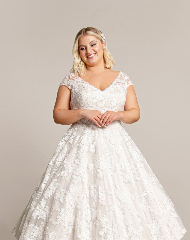 Tea length wedding dress in luxury lace and with a deep v neck bodice cut especially for curvy girls. wr-belinda